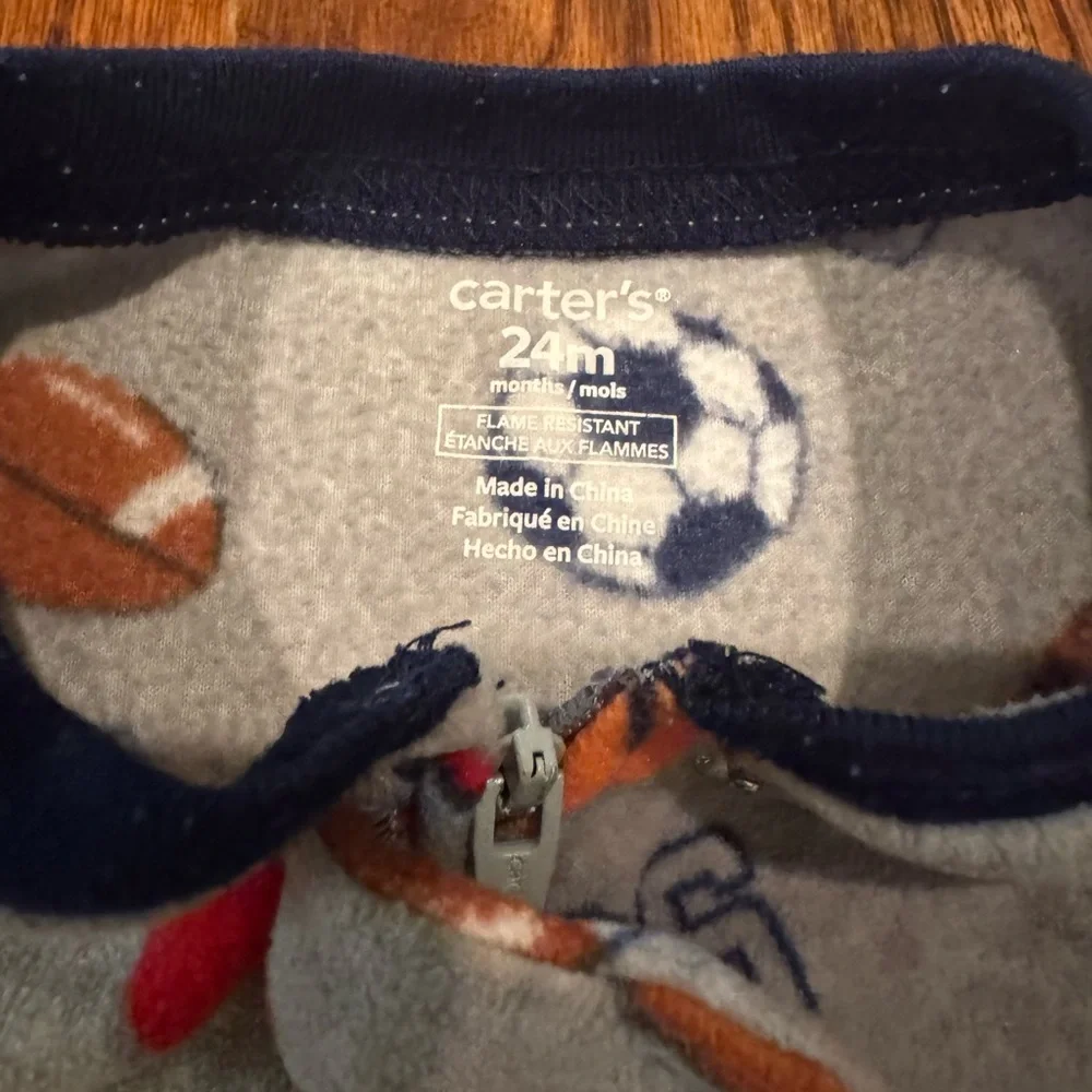Pair of Carter's fleece PJs with zipper and footies.  Size 24 Months